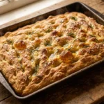 Sourdough focaccia recipe golden crispy bread with rosemary and sea salt in baking pan